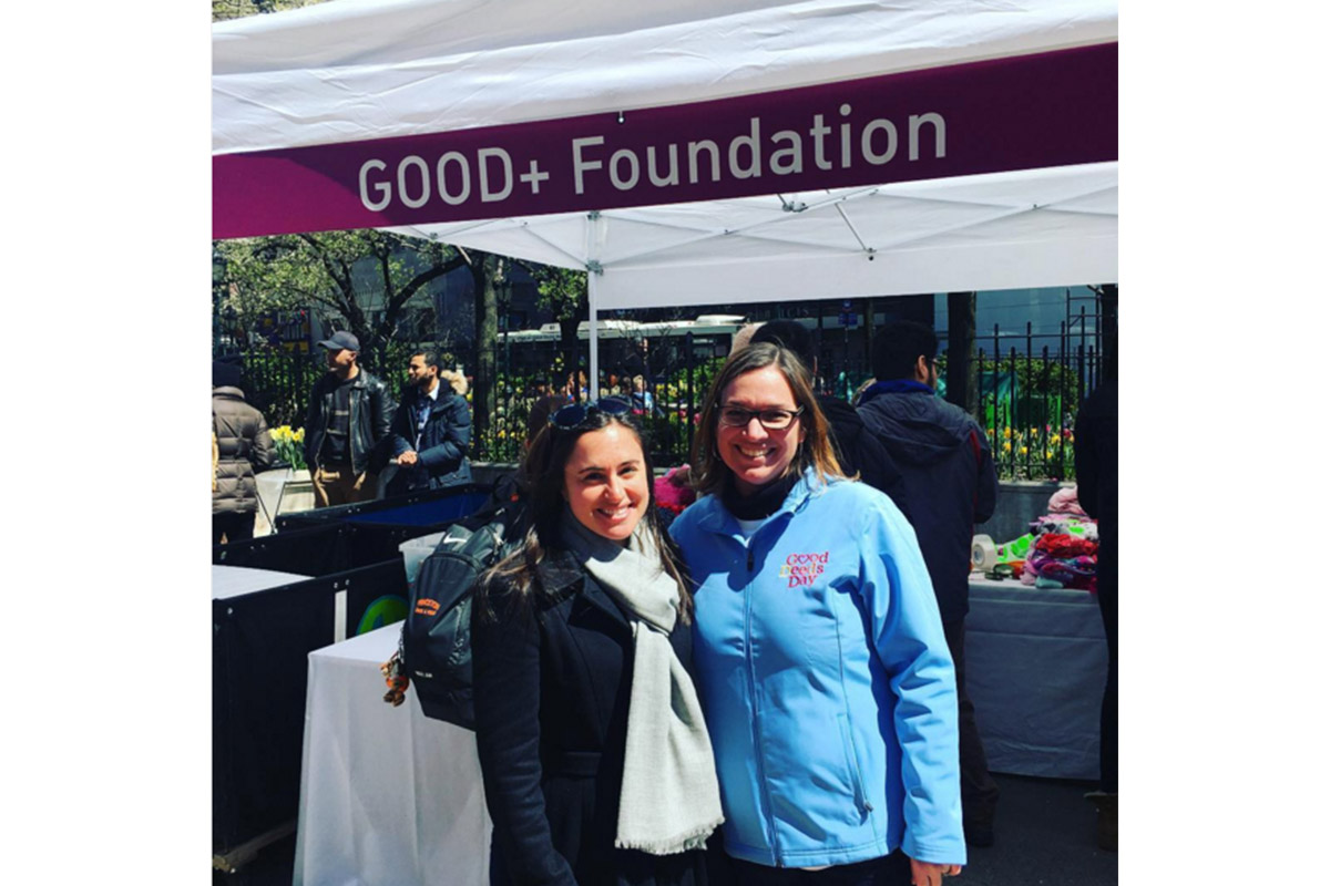 Good+ Foundation staff pose in front of their tent at the NYC Celebration.