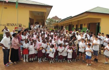 Volunteers renovate a school